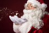 Santa claus blowing some snowflakes